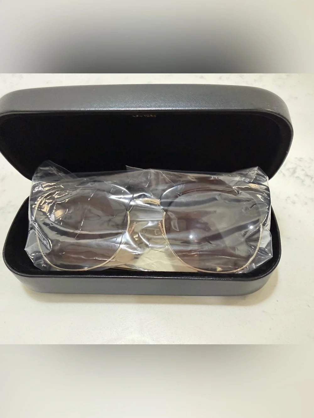 Coach Black Frame Sunglasses with Gold Trim and Brown Lenses